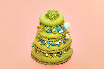Cookie Christmas tree, Christmas tree made of green coockies on  peach background..