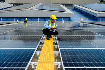 Engineers or Specialist technicians check the quality of installing solar photovoltaic panels and...