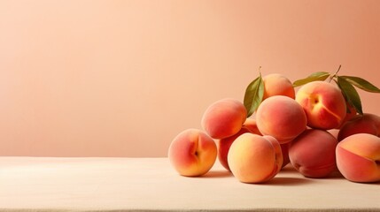  a pile of peaches sitting on top of a table next to a green leafy plant on top of a table.