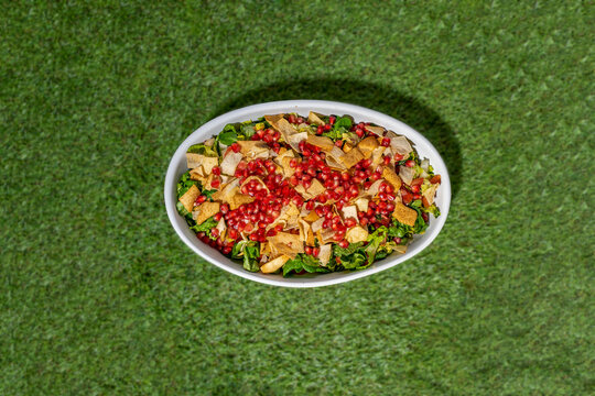 Fattoush salad with pomegranate,  Toast bread Types of lettuce and vegetables.