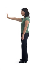 side view of a woman showing the stop sign with their hands on white background