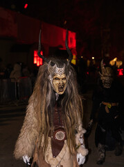 Ceske Budejovice, Czech republic - December 16, 2023: Unidentified people wear Krampus (devil) mask at traditional procession Krampuslauf