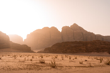 Fototapeta na wymiar Sunset of sand dune and Amazing Rock in Wadi Rum desert, Jordan. Mars landscape