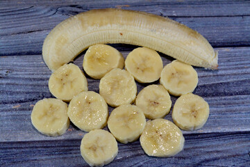 bananas, elongated, edible fruits botanically a berry, produced by several kinds of large...