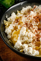 Pasta with cottage cheese, cinnamon and sugar.