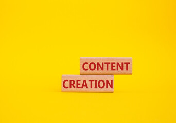 Content creation symbol. Concept word Content creation on wooden blocks. Businessman hand....