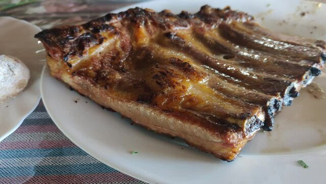 Canarian potatoes with red mojo and grilled ribs with barbecue sauce