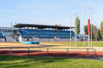 Fototapeta premium Sports stadium with athletic field and stands