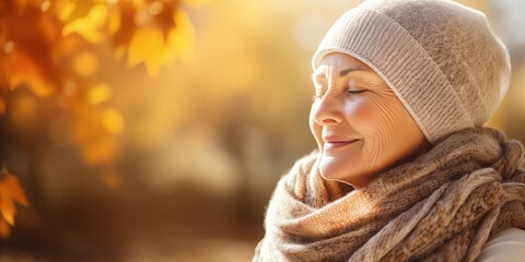 Serene woman enjoying autumn warmth in knitwear. Seasonal comfort and warmth.