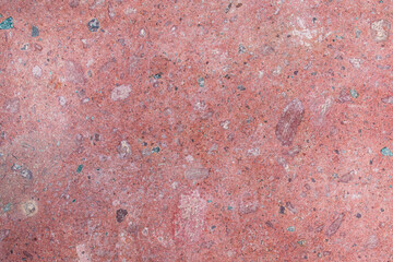 Imagen horizontal de una pared de piedra de granito color roja ideal para texturas 