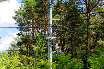 Fototapeta premium Components of the power line in the forest