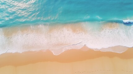 An aerial picture of a sandy beach near the sea with waves, surrounded by a gorgeous stretch of white sand.