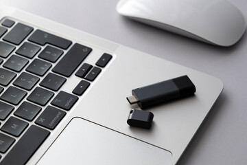 Modern USB Type-c flash drive on the laptop keyboard