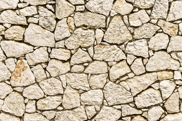 Pattern formed by the stones in a wall, No people. Background.
