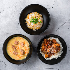Rice scrambled eggs, soup with noodles and pork with basmati rice and pineapple.