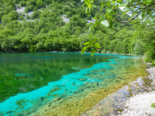 Scenic view of turquoise colored Lake Cornino near Udine in Friuli-Venezia Giulia, Italy, Europe. Peaceful serene scene on Alpe Adria trail in Italian Alps. Calcium sulphate gypsum in water. Awe