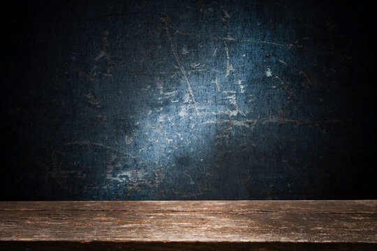 Empty wooden table with free space for advertising, dark background. For product display mounting
