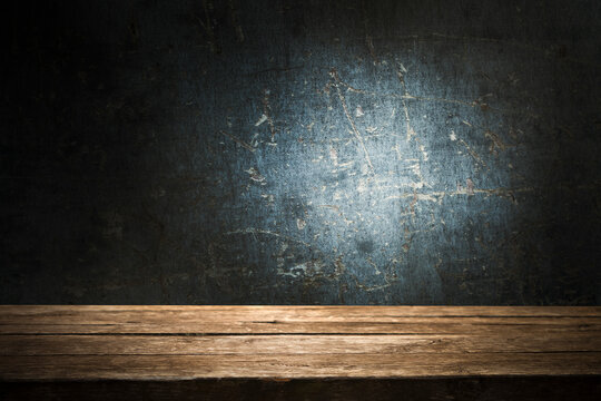 Empty wooden table with free space for advertising, dark background. For product display mounting