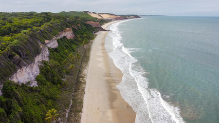 Beautiful beaches in Pipa and Natal, Brazil. All the colors of the beach and the city. Golden Sand, Crystal clear ocean, Palm trees, rocks and skyscrapers