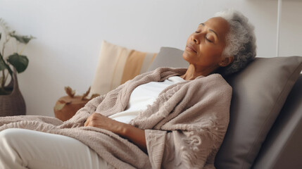 copy space, elderly black woman taking a nap on a pillow on background. National Napping Day. retired black woman resting while tired. Peaceful scene.