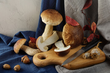 Beautiful autumn still life with boletus mushrooms and other forest products