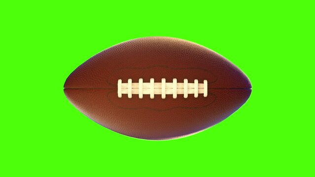 Spinning American football ball. Green screen