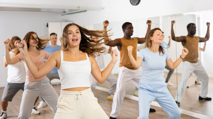 Dance class for adult people, positive women and men training in studio