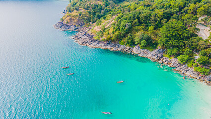 Paradise beach Phuket Patong. aerial top view amazing freedom beach small white sand beach with perfect nature. white wave hit the rock around island. green forest peaceful. green sea, landscape. - obrazy, fototapety, plakaty