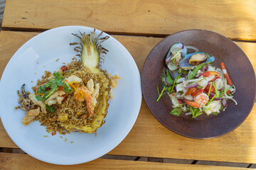 Seafood fried rice in pineapple, appetizing in a cafe next to the sea, Sue Flamingo, Ao Yon Beach, Phuket Thailand