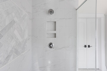 Modern Bathroom Shower Niche with Elegant White Marble Tiles and Chrome Fixtures in Contemporary...