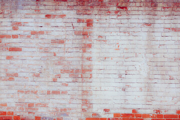 Old grungy red brick wall. Free space for an inscription. Can be used as a background or poster....