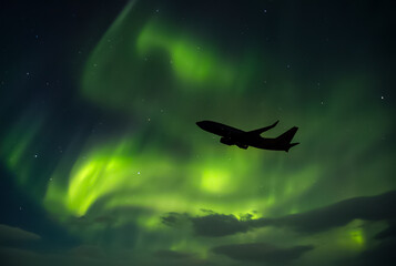 Obraz na płótnie Canvas Plane with Northern lights (Aurora Borealis) 