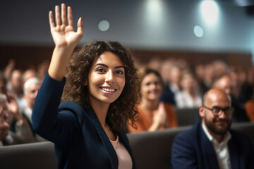 young businesswoman raises hand during audience question day - obrazy, fototapety, plakaty