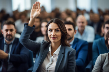 Fototapeta na wymiar young businesswoman raises hand during audience question day