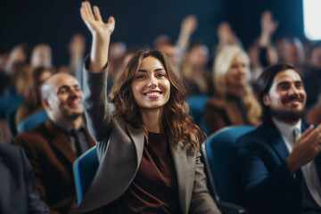 young businesswoman raises hand during audience question day - obrazy, fototapety, plakaty