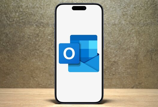 Microsoft Outlook Logo, email client, with functions as calendaring, task managing, contact managing, notes, shown on a modern smartphone