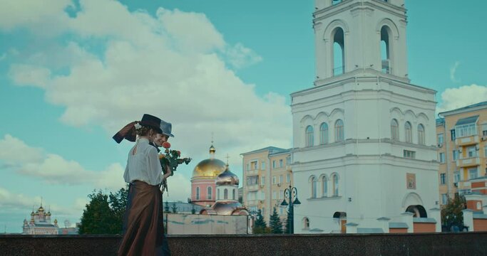 man and woman in vintage style clothing walking in city, date of couple in 19th century, 4K, Prores