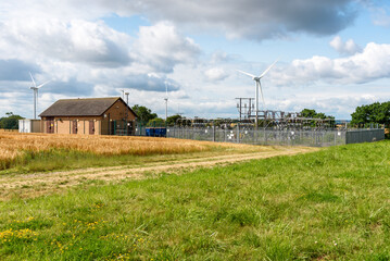 Electrical substation in a wind farm in the English countryside on a sunny summer day
