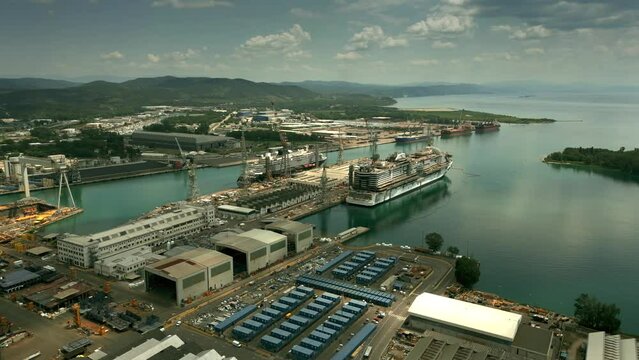 Aerial shot of two new cruise ships under construction in the big shipyard. Monfalcone, Italy