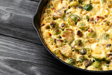 Creamy Garlic Parmesan Brussel Sprouts with Bacon in iron cast pan