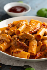 Gochujang Pasta with chicken, sun dried tomatoes and pecorino cheese.