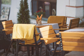 Coffeehouse cafe restaurant terrace. Wooden chairs and tables. Outdoor terrace concept. Shallow...