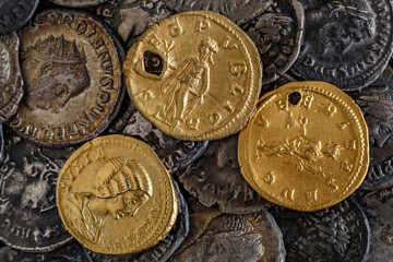 A treasure of Roman gold and silver coins.Trajan Decius. AD 249-251. AV Aureus.Ancient coin of the Roman Empire.Authentic silver denarius, antoninianus,aureus of ancient Rome.Antikvariat.
