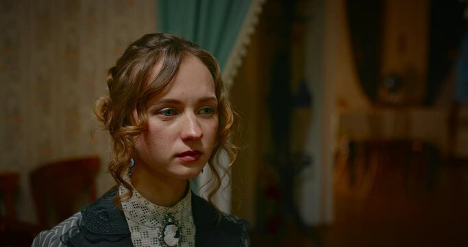 portrait of sad beautiful woman in retro gown crying sitting in house of 19th century, 4K, Prores