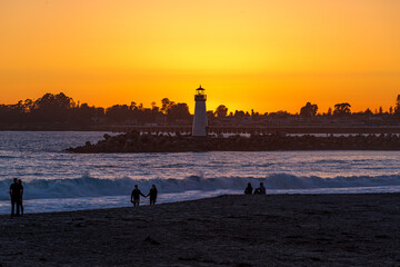 Couples gather around for sunset at Walton Lighthouse in Santa Cruz, CA