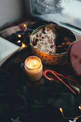 Burning soy wax candle in a Christmas atmosphere, mood