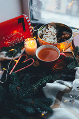 A cup of tea with smoke in a Christmas atmosphere, mood