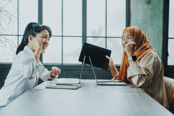Happy multiethnic smiling business asian women working together in office, concept working woman,...