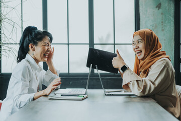 Happy multiethnic smiling business asian women working together in office, concept working woman,...