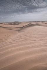 The Badain Jaran Desert is a desert in China, vertical image